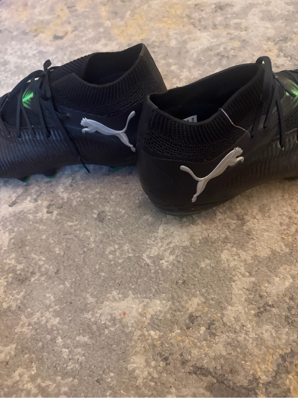 Puma Kids Black Soccer Cleats with Green Accents